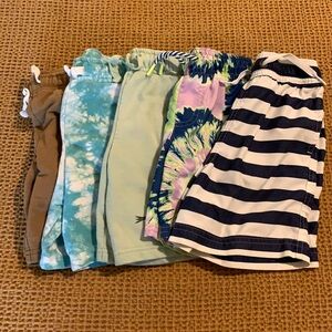 Boys 4T swim trunks and 5T play condition shorts.